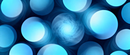 Glowing swirling abstract blue circles with light effects and soft gradients creating a futuristic and dynamic background.の素材