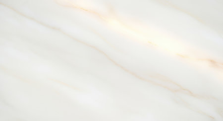 Soft white marble surface with subtle golden veining and smooth polished texture for elegant modern interior background design.の素材