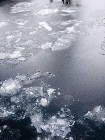 cold river covered by first iceの写真素材