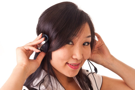 asian girl with headset isolated on whiteの写真素材