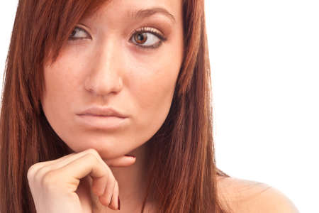 the pensive attractive girl isolated on whiteの写真素材