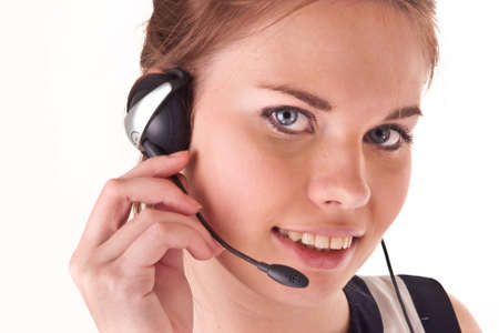 pretty girl with headset and smile isolated on whiteの写真素材