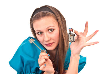 The nice girl holds the lock and a keyの写真素材