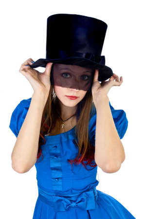 the pretty female in the topper and blue dress isolated on whiteの写真素材