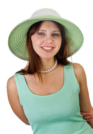 young pretty female smiling in green hat isolated on whiteの写真素材