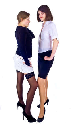 two young females standing isolated on the whiteの写真素材