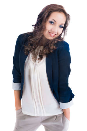 young female with hands in pockets in blue jacket isolated on whiteの写真素材