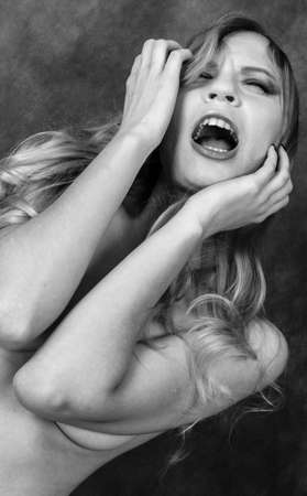 young topless female cry  black and whiteの写真素材