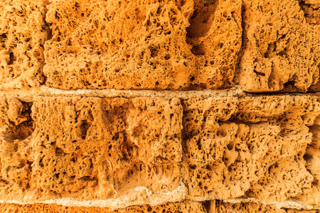 Background of ancient  brick wall. Texture of old amphitheater stone for design.の写真素材