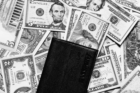 Background with money american dollar bills and passport. Cash dollars.の写真素材