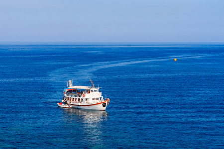 Boat on sea in summer season with blue sky background.