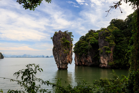 The famous karst rock of the island of James Bond against a blue sky with clouds on a sunny day....