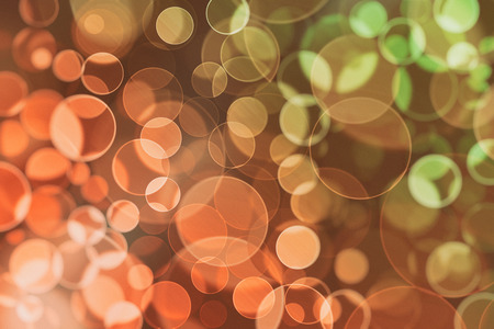 Lights holiday bokeh. Abstract round Christmas background for design. Blur. Gradient.