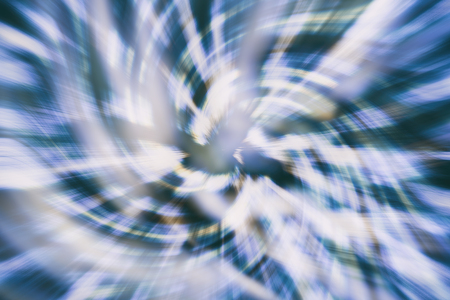Blue and black abstract background for design with radial blur.