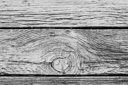 Monochrome texture of a board with peeling paint. Abstract background for design.の写真素材