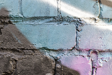 Fragment of colored graffiti painted on a brick wall. Texture. Abstract background for design.の写真素材