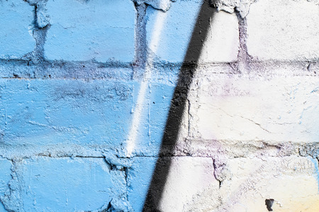 Fragment of colored graffiti painted on a brick wall. Texture. Abstract background for design.の写真素材