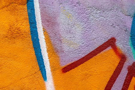 Fragment of colored graffiti painted on a concrete wall. Texture. Abstract background for design.の写真素材