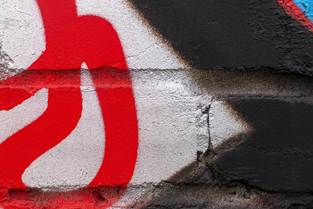 Fragment of colored graffiti painted on a brick wall. Texture. Abstract background for design.の写真素材