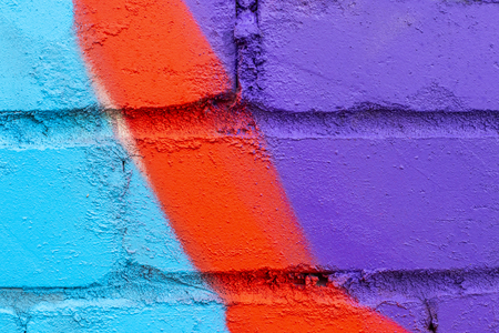 Fragment of colored graffiti painted on a brick wall. Texture. Abstract background for design.の写真素材