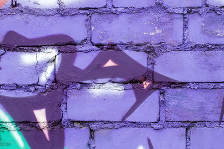 Fragment of colored graffiti painted on a brick wall. Texture. Abstract background for design.の写真素材