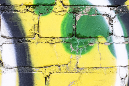 Fragment of colored graffiti painted on a brick wall. Texture. Abstract background for design.の写真素材
