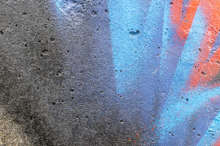 Fragment of colored graffiti painted on a concrete wall. Texture. Abstract background for design.の写真素材