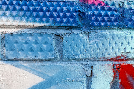 Fragment of colored graffiti painted on a brick wall. Texture. Abstract background for design.の写真素材