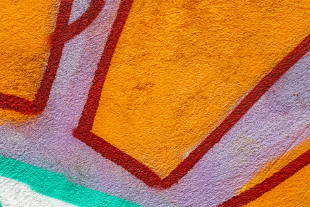 Fragment of colored graffiti painted on a concrete wall. Texture. Abstract background for design.の写真素材