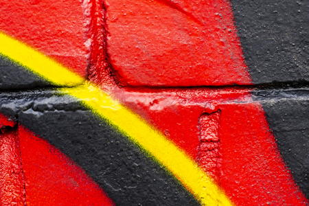 Fragment of colored graffiti painted on a brick wall. Texture. Abstract background for design.の写真素材