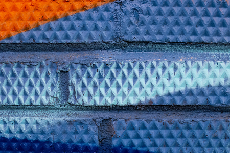 Fragment of colored graffiti painted on a brick wall. Texture. Abstract background for design.の写真素材