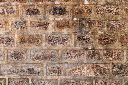 Background of ancient stone wall. Texture of old brick.の写真素材
