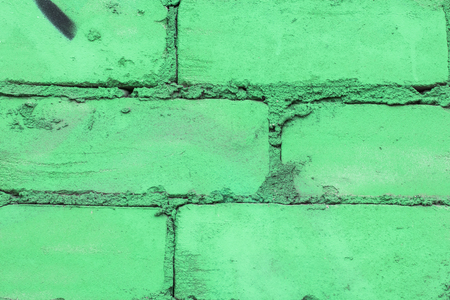 Fragment of colored graffiti painted on a brick wall. Texture. Abstract background for design.の写真素材