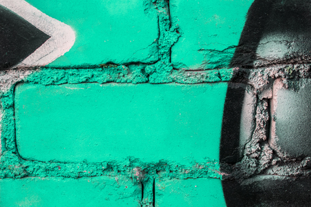 Fragment of colored graffiti painted on a brick wall. Texture. Abstract background for design.の写真素材