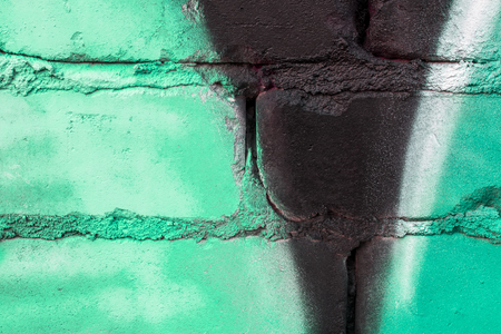 Fragment of colored graffiti painted on a brick wall. Texture. Abstract background for design.の写真素材