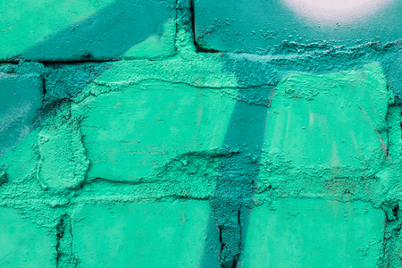Fragment of colored graffiti painted on a brick wall. Texture. Abstract background for design.の写真素材
