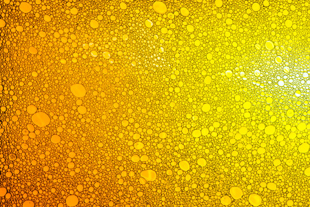 Colorful drops of oil on the water. Colored circles, ovals. Abstract bright background for design.