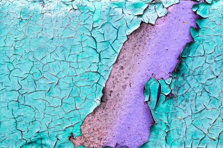 Fragment of colored graffiti painted on a concrete wall. Texture. Abstract background for design. Peeling color paint.の写真素材