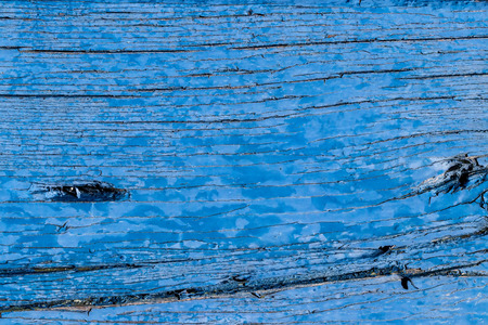 Texture of a blue old board or plank with peeling paint. Abstract background for design.の写真素材
