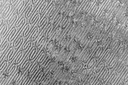 Texture of glass with a pattern. Abstract background for design.
