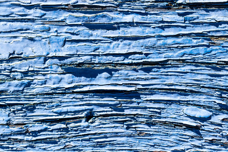 Texture of a blue old board or plank with peeling paint. Abstract background for design.の写真素材