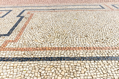 Top view on paving stone road. Old pavement of granite texture. Street cobblestone sidewalk. Abstract background for design.の写真素材