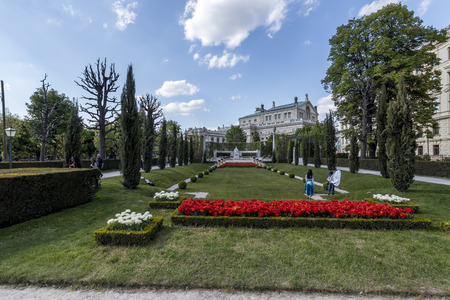 VIENNA, AUSTRIA - APRIL 22, 2019: Beautiful park with flowers, lawns and trees on a sunny spring day in the center of city.のeditorial素材