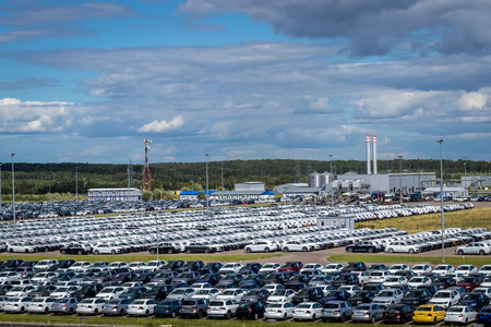 Volkswagen, Russia, Kaluga  - JULY 4, 2019: New cars parked in a distribution center on a sunny day in the summer, a car factory. Parking in the open air.のeditorial素材