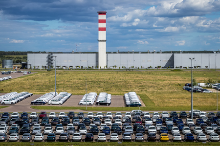 Volkswagen, Russia, Kaluga  - JULY 4, 2019: New cars parked in a distribution center on a sunny day in the summer, a car factory. Parking in the open air.のeditorial素材