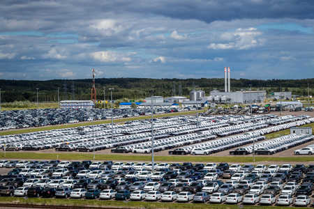 Volkswagen, Russia, Kaluga  - JULY 4, 2019: New cars parked in a distribution center on a sunny day in the summer, a car factory. Parking in the open air.のeditorial素材