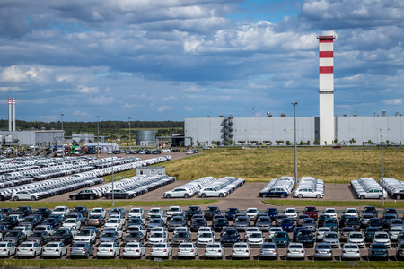 Volkswagen, Russia, Kaluga  - JULY 4, 2019: New cars parked in a distribution center on a sunny day in the summer, a car factory. Parking in the open air.のeditorial素材