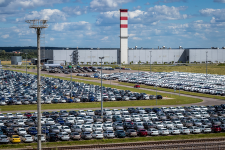 Volkswagen, Russia, Kaluga  - JULY 4, 2019: New cars parked in a distribution center on a sunny day in the summer, a car factory. Parking in the open air.のeditorial素材