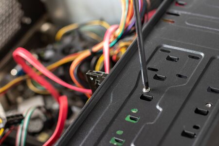 Concept of a computer repair. Hard drive instalation with turn-screw.の写真素材