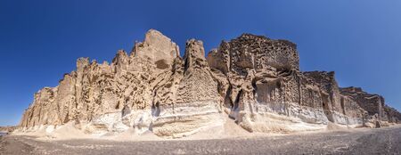 Canyon mountains on Vlychada beach on a sunny summer day with blue sky background. Santorini island, Greece. Panorama.の写真素材